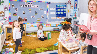 A classroom of kids and a teacher.
